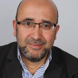 Foto: Directeur PBL Maarten Hajer met achter hem een projectie van de vier toekomstbeelden